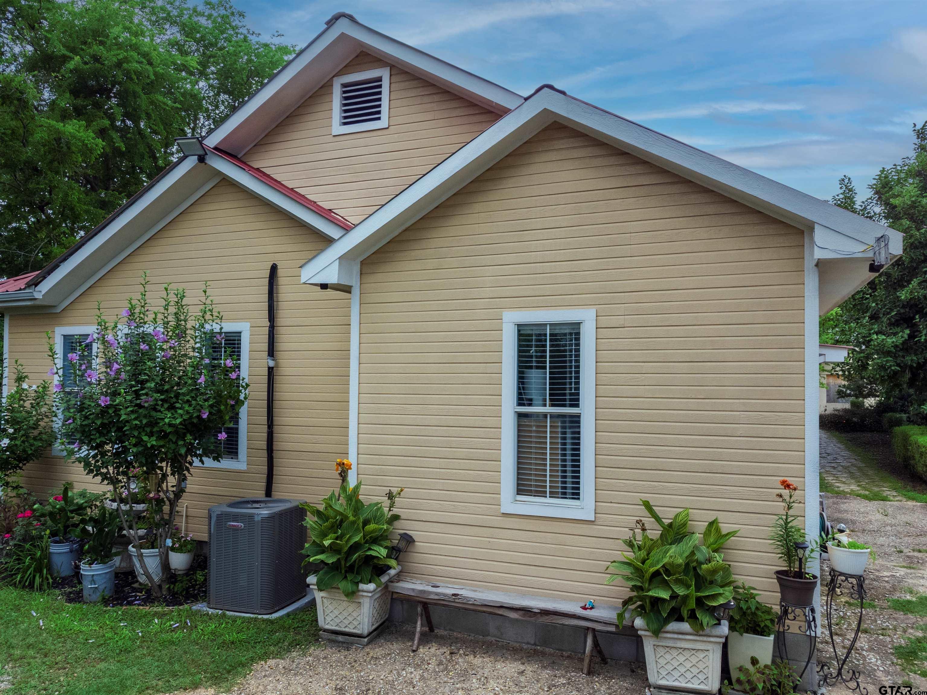 427 East Locust Street Tyler, TX 75702 - Photo 37 of 42 a front view of a house with garden