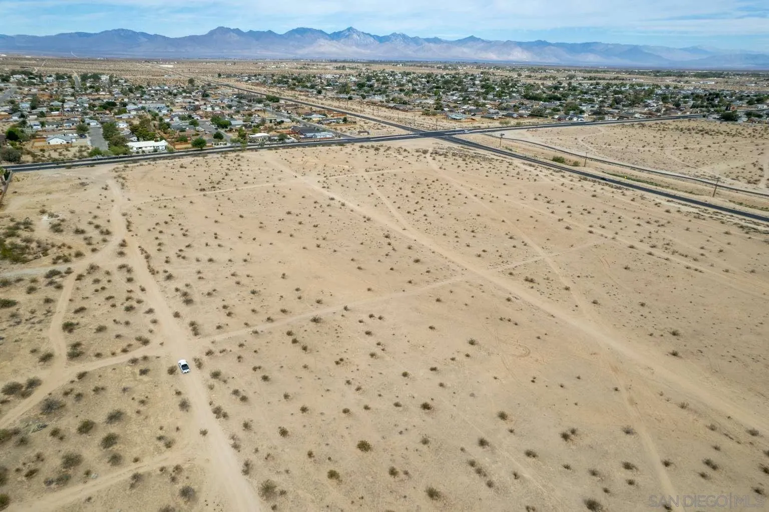 0 West Perch Avenue, Unit 15 Ridgecrest, CA 93555 - Photo 5 of 40 a view of a dry yard with a large trees
