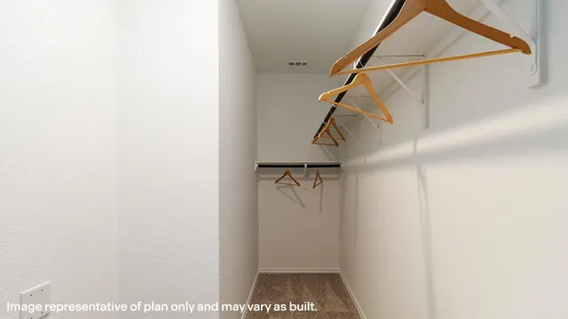 a bedroom with a bed and a table