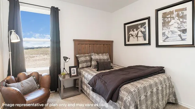 a bedroom with a bed and furniture