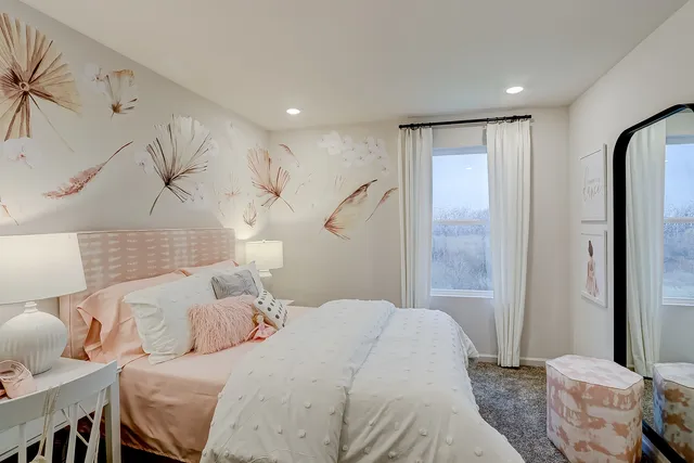 a bedroom with a bed and a table in it