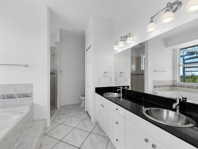 a view of a porch with furniture and a ceiling fan
