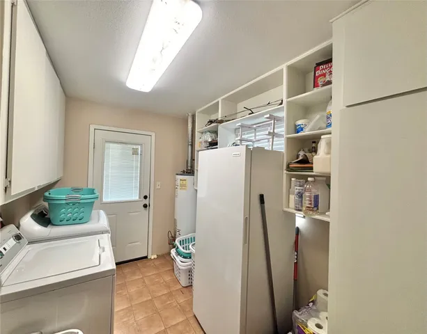 a bedroom with a bed a dresser and chair
