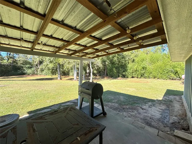 a view of a swimming pool with an outdoor space and seating area