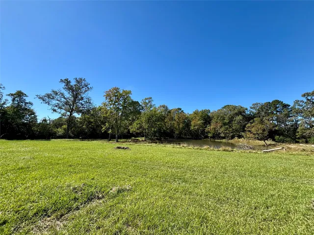 a view of a lake with houses in the back