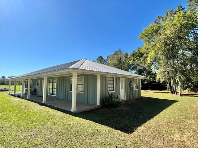 a view of a house with a garden