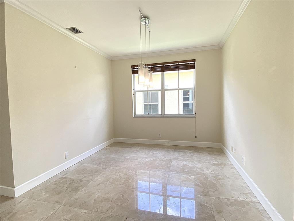 4375 Foxtail Lane Weston, FL 33331 - Photo 28 of 84 a view of an empty room with a window