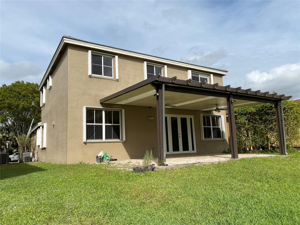 4375 Foxtail Lane Weston, FL 33331 - Photo 51 of 84 front view of a house with a yard