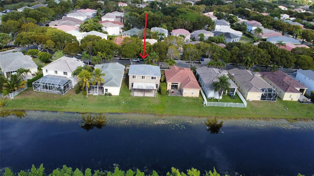 4375 Foxtail Lane Weston, FL 33331 - Photo 62 of 84 an aerial view of residential house with outdoor space and parking