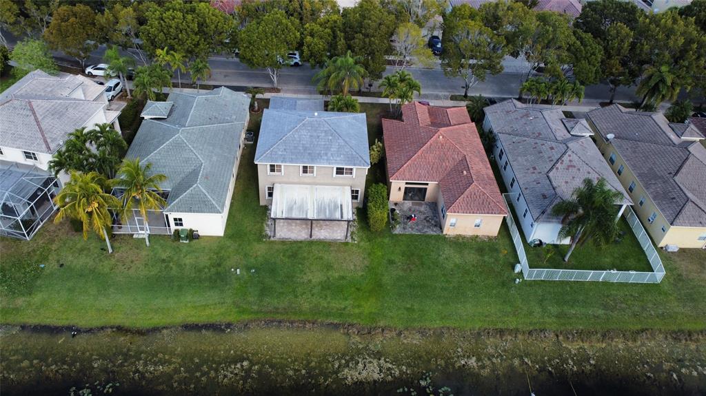 4375 Foxtail Lane Weston, FL 33331 - Photo 63 of 84 an aerial view of residential houses with outdoor space and trees