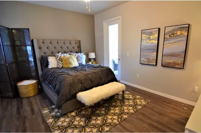 a bedroom with a bed and window