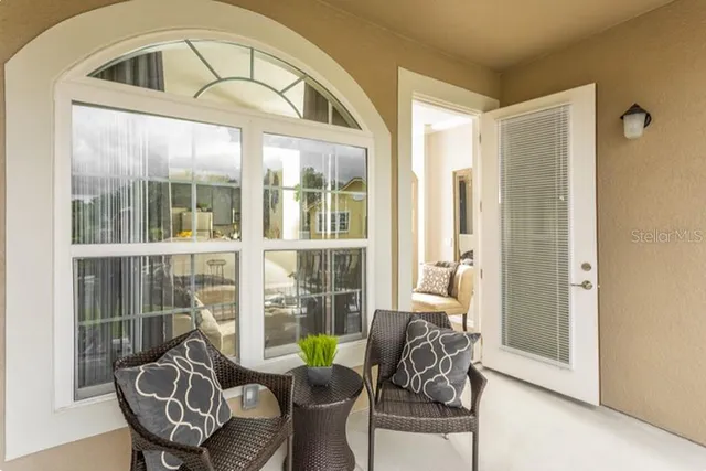 a living room with furniture and a large window
