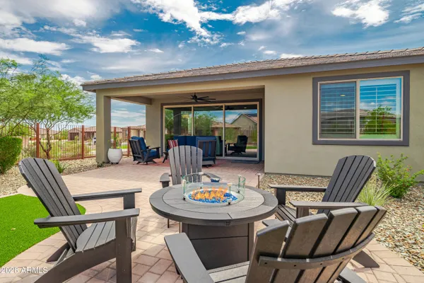 a outdoor dining space with furniture and garden view