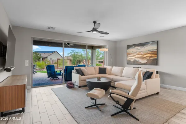 a living room with furniture and a large window