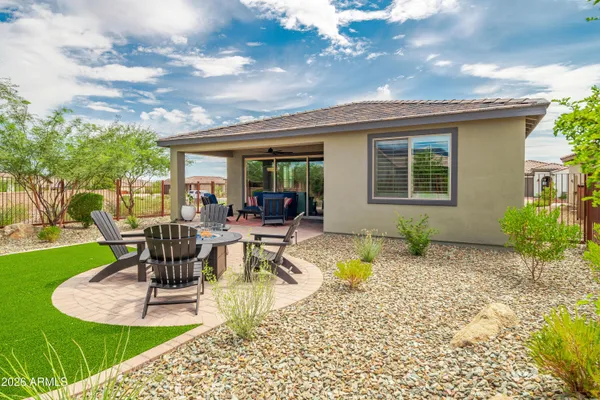 a view of a house with backyard porch and patio