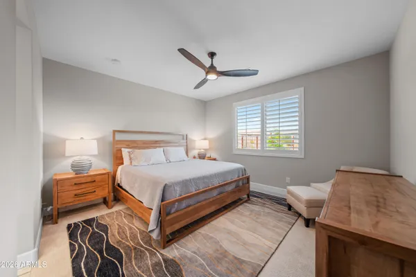 a bedroom with a bed and window