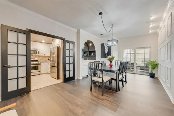 a view of a dining room with furniture and window