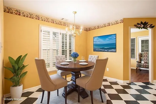 a view of a dining room with furniture and windows