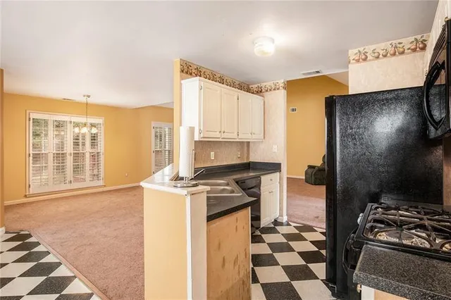 a kitchen with a stove a refrigerator and a stove