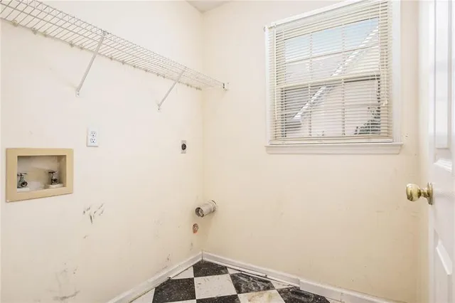 a bathroom with a window and a shower