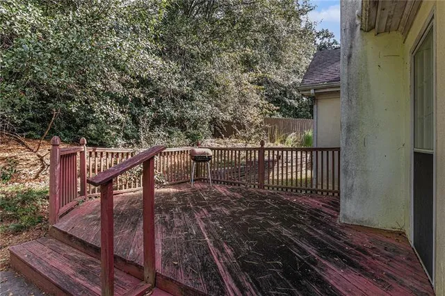 a balcony with wooden floor