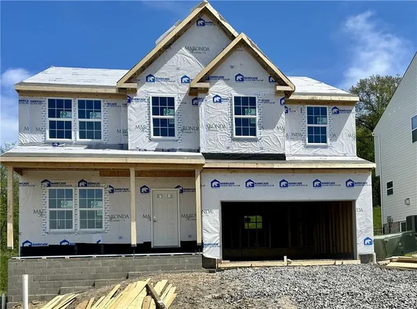 a front view of a house with glass windows