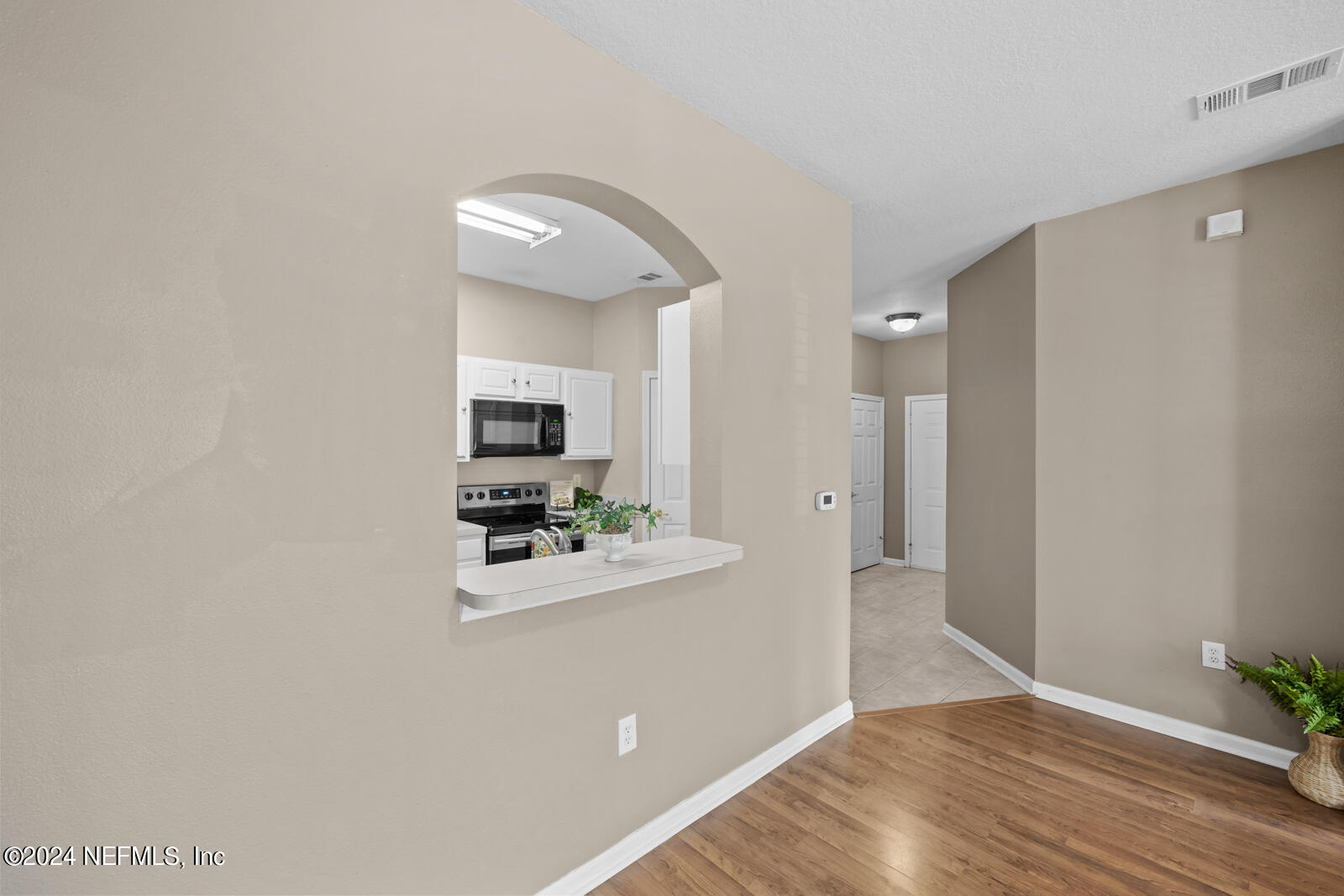 7990 Baymeadows Road East, Unit 905 Jacksonville, FL 32256 - Photo 12 of 37 Pass thru from Kitchen