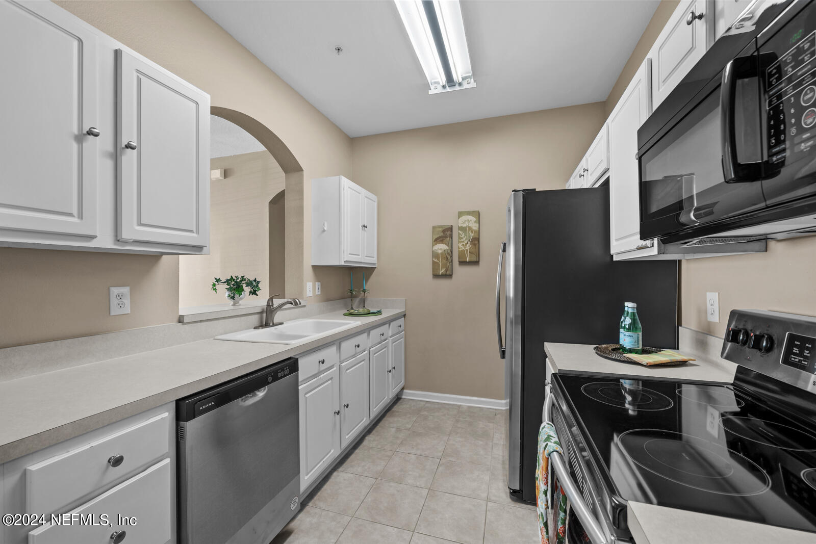 7990 Baymeadows Road East, Unit 905 Jacksonville, FL 32256 - Photo 10 of 37 Kitchen has pass thru to dining area