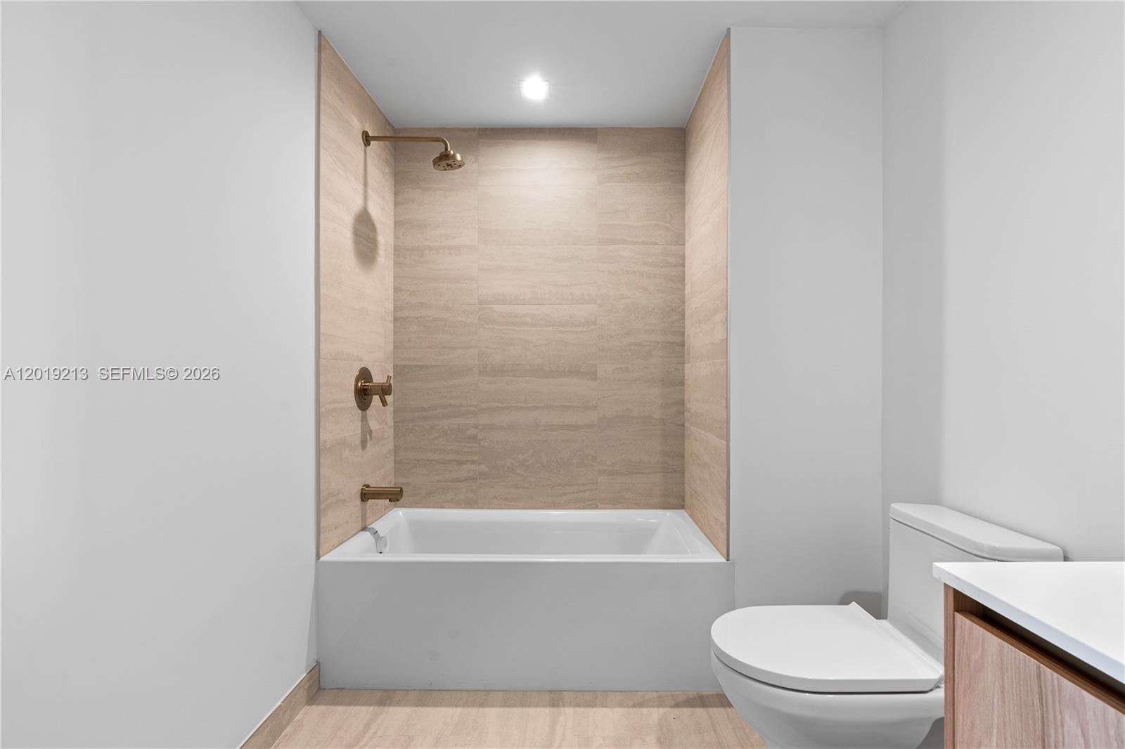 77 Southeast 5th, Unit 3702 Miami, FL 33131 - Photo 35 of 63 a bathroom with a toilet and a bathtub