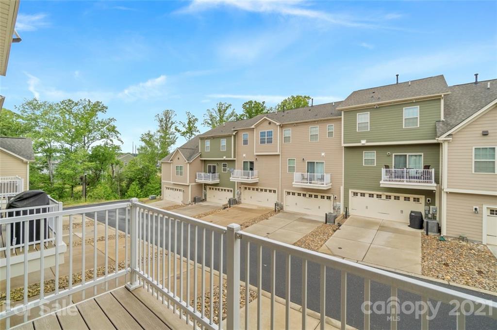 206 Butterfly Place, Unit 185 Tega Cay, SC 29708 - Photo 18 of 36 a view of a building from a balcony