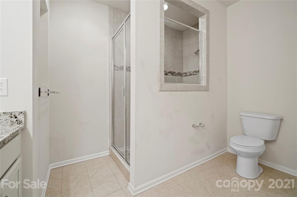 206 Butterfly Place, Unit 185 Tega Cay, SC 29708 - Photo 26 of 36 a bathroom with a toilet and a sink