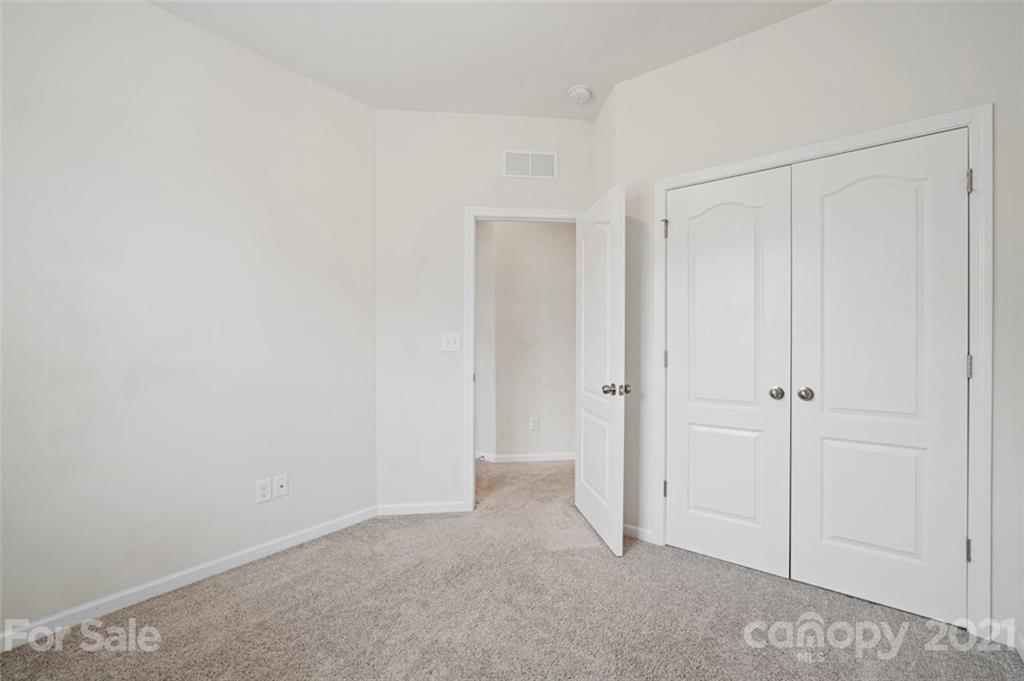 206 Butterfly Place, Unit 185 Tega Cay, SC 29708 - Photo 30 of 36 a view of an empty room