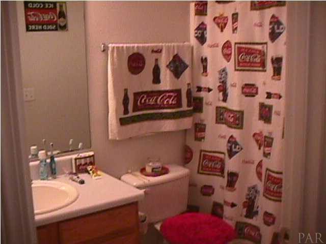 5334 Sewell Road Milton, FL 32570 - Photo 4 of 7 a bathroom with a sink and a toilet