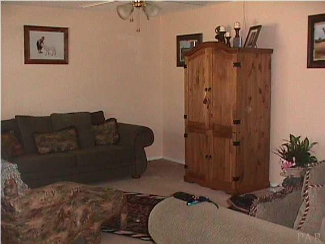 5334 Sewell Road Milton, FL 32570 - Photo 5 of 7 a living room with furniture