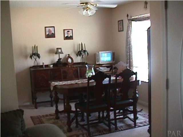5334 Sewell Road Milton, FL 32570 - Photo 6 of 7 a view of a dining room with furniture