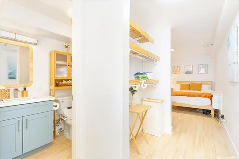 a bedroom with a bed and a cabinets