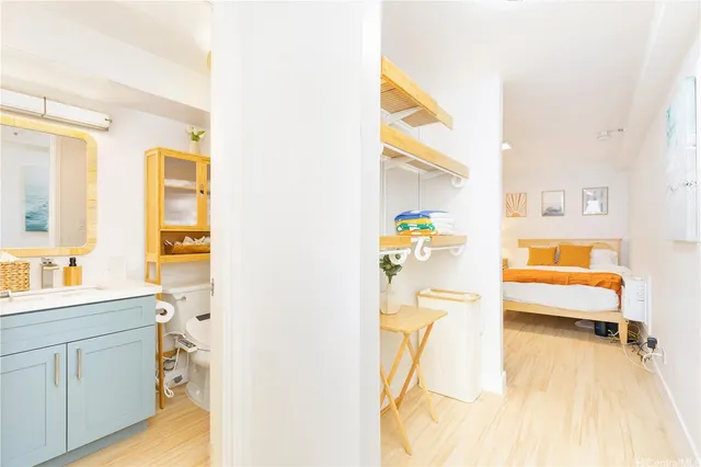 a bedroom with a bed and a cabinets