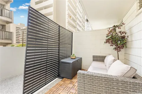 a view of balcony with couch and potted plants