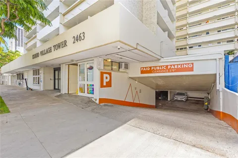 a view of a building with retail shops