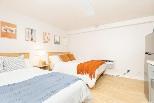 a bedroom with two beds and painted walls