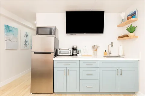 a kitchen with white cabinets