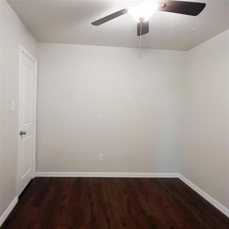 602 Sabine Avenue Cleburne, TX 76031 - Photo 5 of 14 a view of an empty room with wooden floor