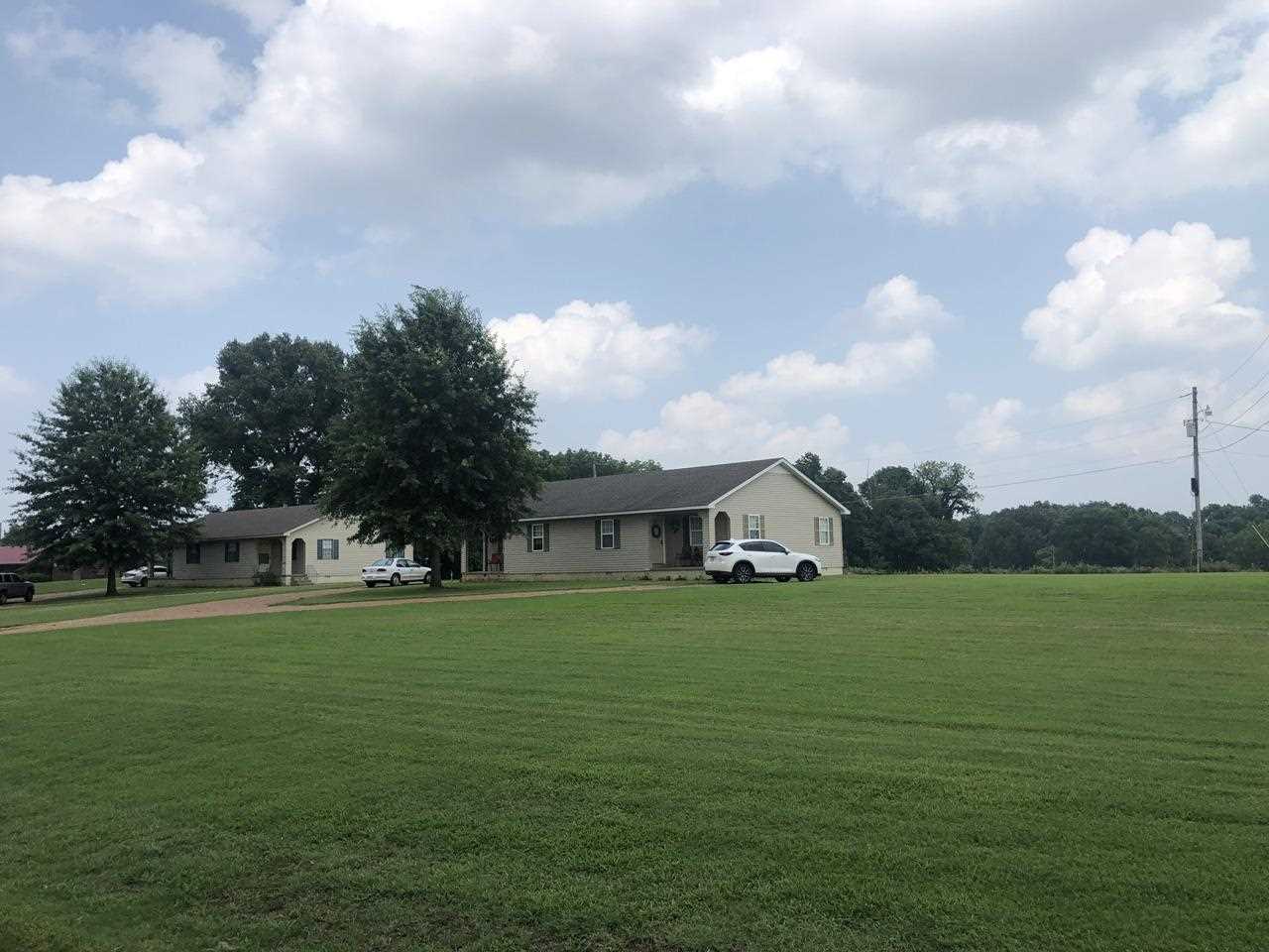 Barlow-chisholm Lake Road Ripley, TN 38063 - Photo 2 of 13 a front view of a house with a garden
