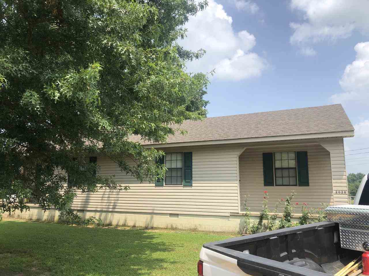 Barlow-chisholm Lake Road Ripley, TN 38063 - Photo 5 of 13 a front view of house with yard and trees in the background