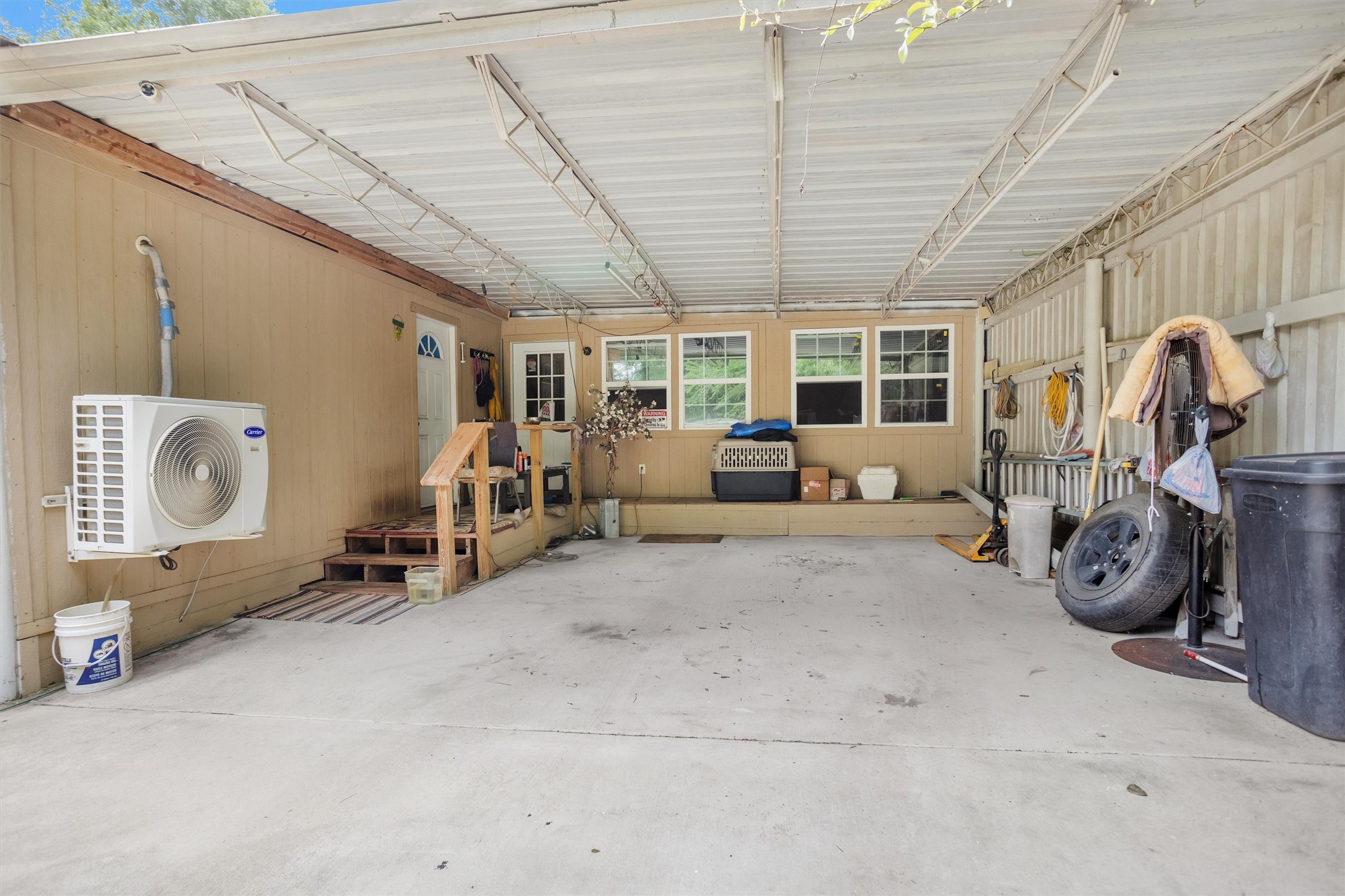 30806 Mellman Road Hempstead, TX 77445 - Photo 35 of 35 The room with the door and windows is 20x20 and could be a 2nd bedroom, workshop, hobby room, storage because the possibilities are endless.