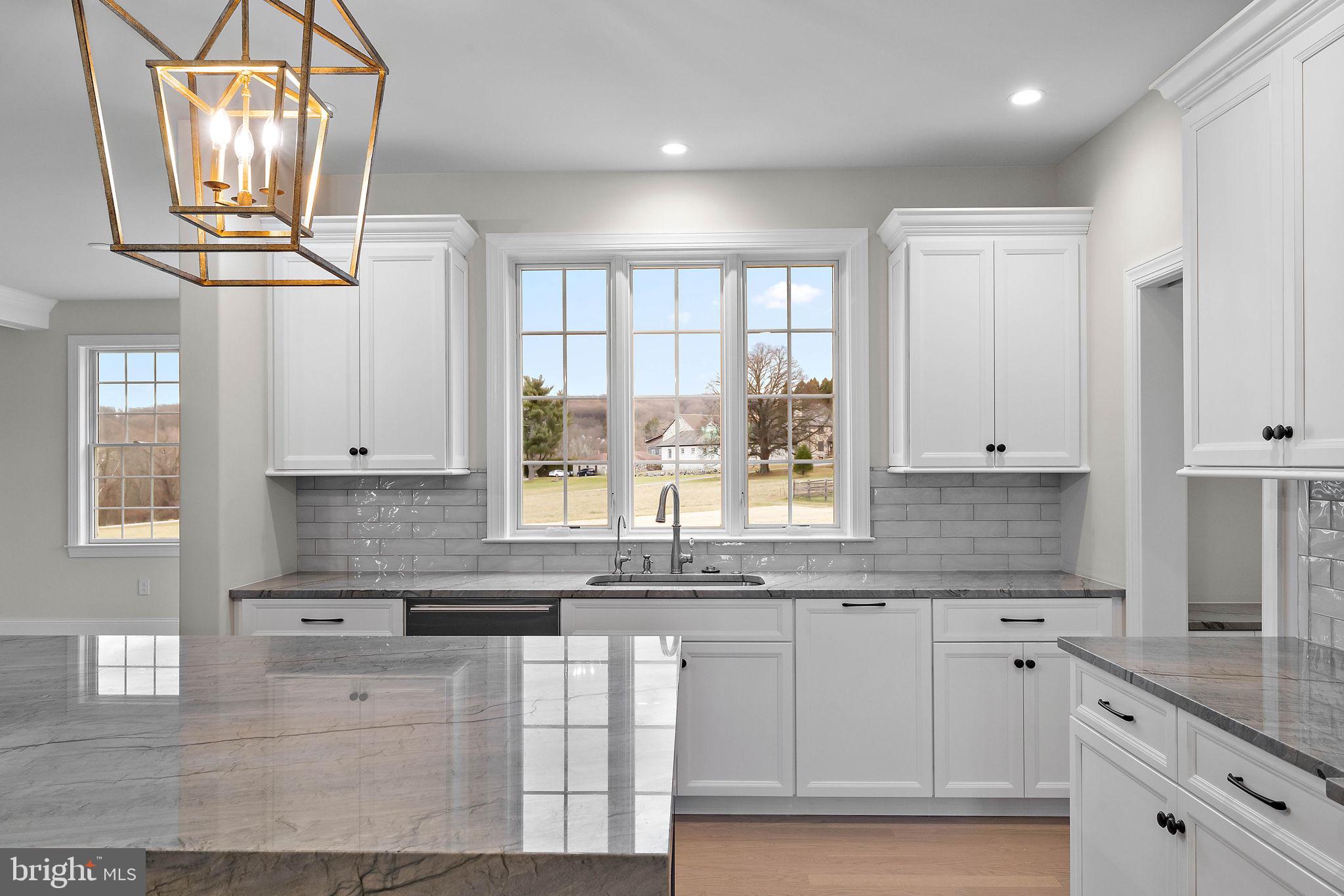 Lot B Howell Road Malvern, PA 19355 - Photo 22 of 46 a kitchen with stainless steel appliances granite countertop a sink a window and cabinets