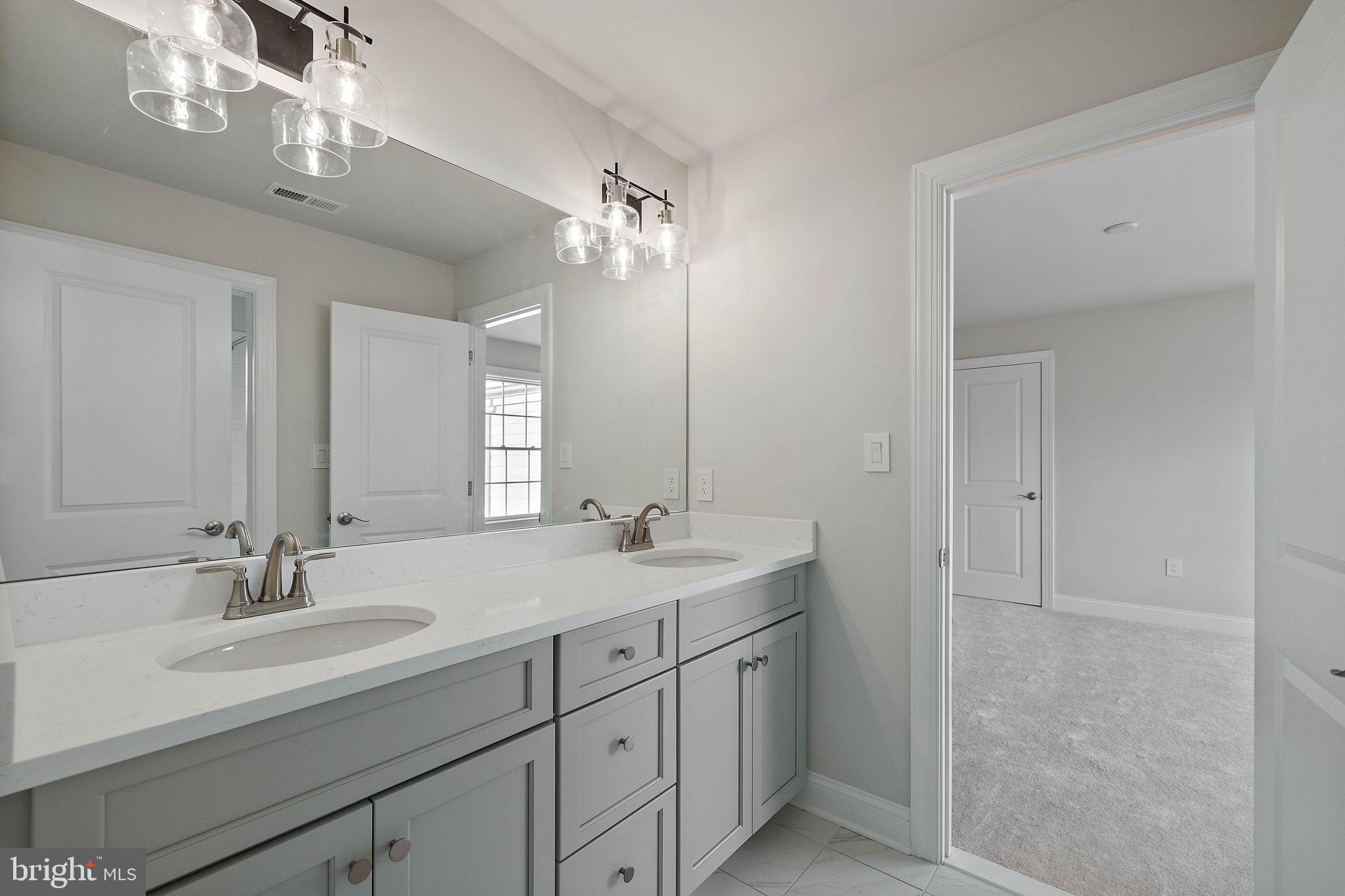 Lot B Howell Road Malvern, PA 19355 - Photo 38 of 46 a bathroom with a double vanity sink a mirror and a shower
