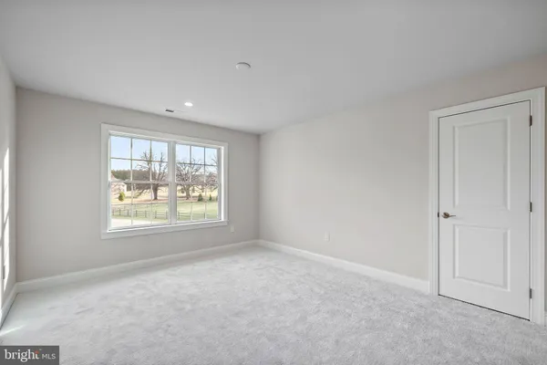 a room with a window and a wooden floor