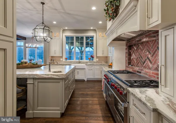 a kitchen with a stove and a sink