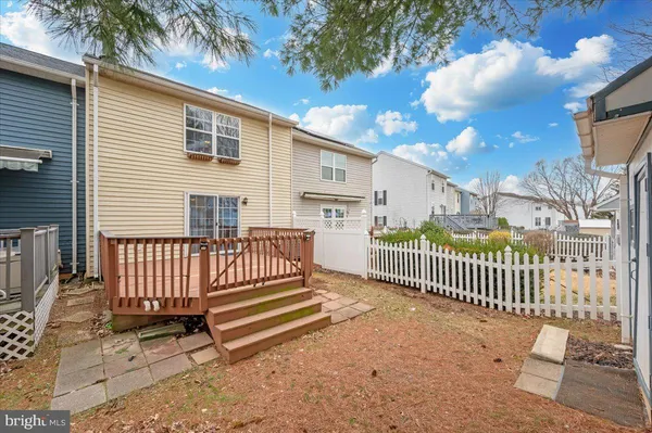 a view of a house with a wooden deck